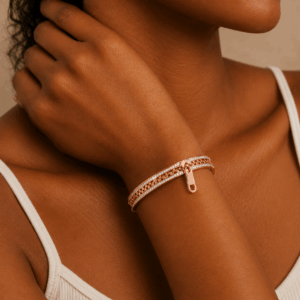 Close-up of a rose gold zipper-inspired bracelet