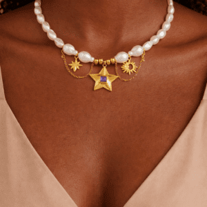 Gold pearl necklace with star and sun charms