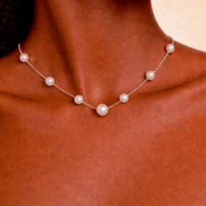 Minimalist silver necklace with evenly spaced white pearls