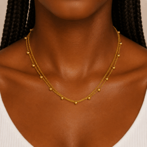 Gold stainless steel layered necklace with polished bead accents